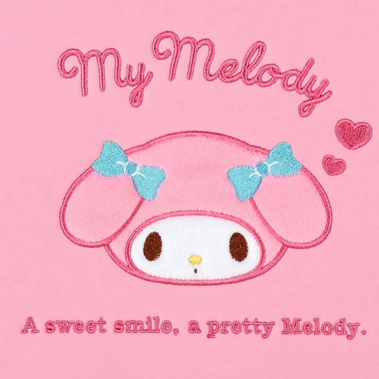 Sanrio My Melody padded laptop case in pink showing close up of my melody face design
