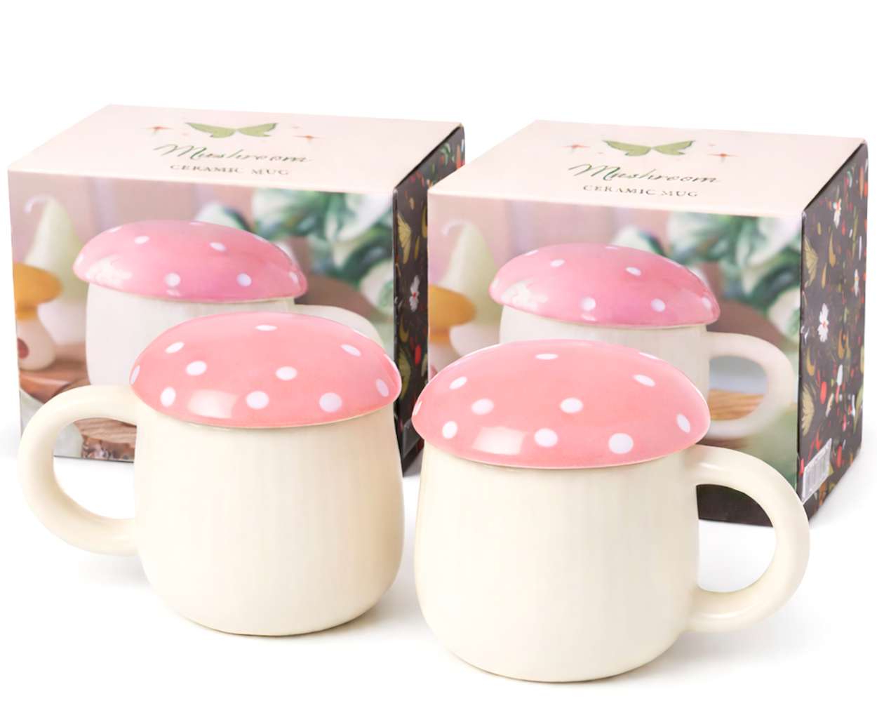Two ceramic mugs with pink mushroom lids in front of their packaging box.