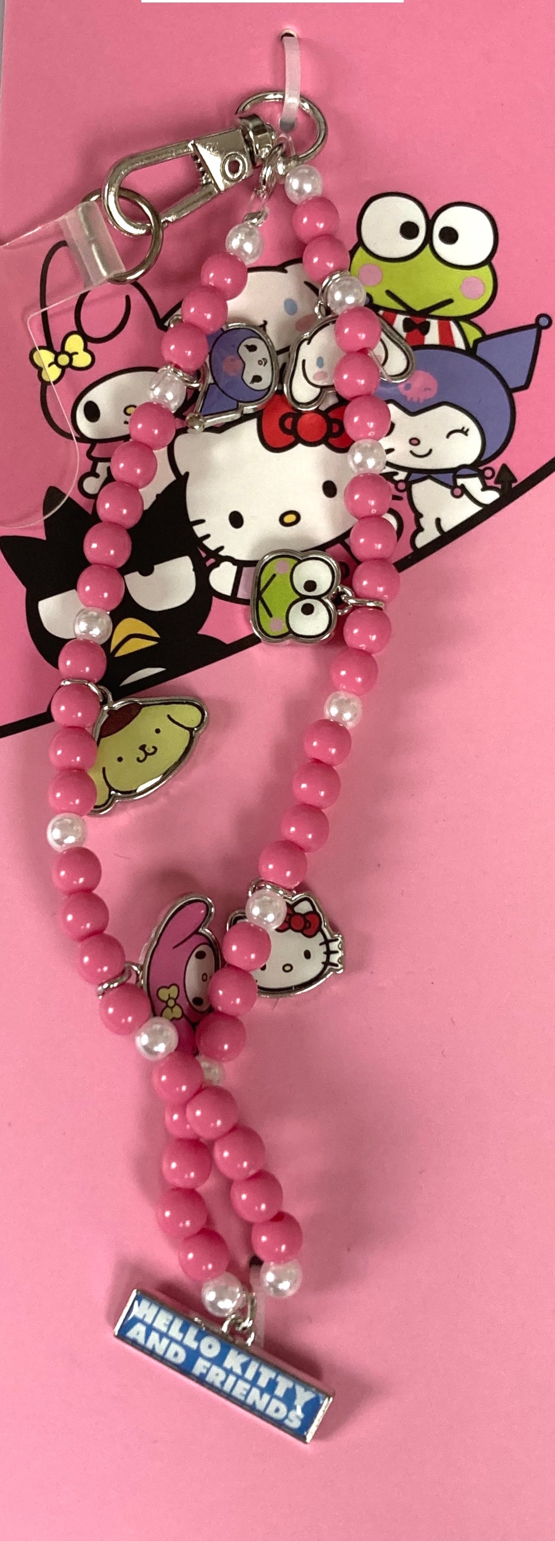 Hello Kitty & Friends pink beaded phone charm with metal character charms on pink backing card