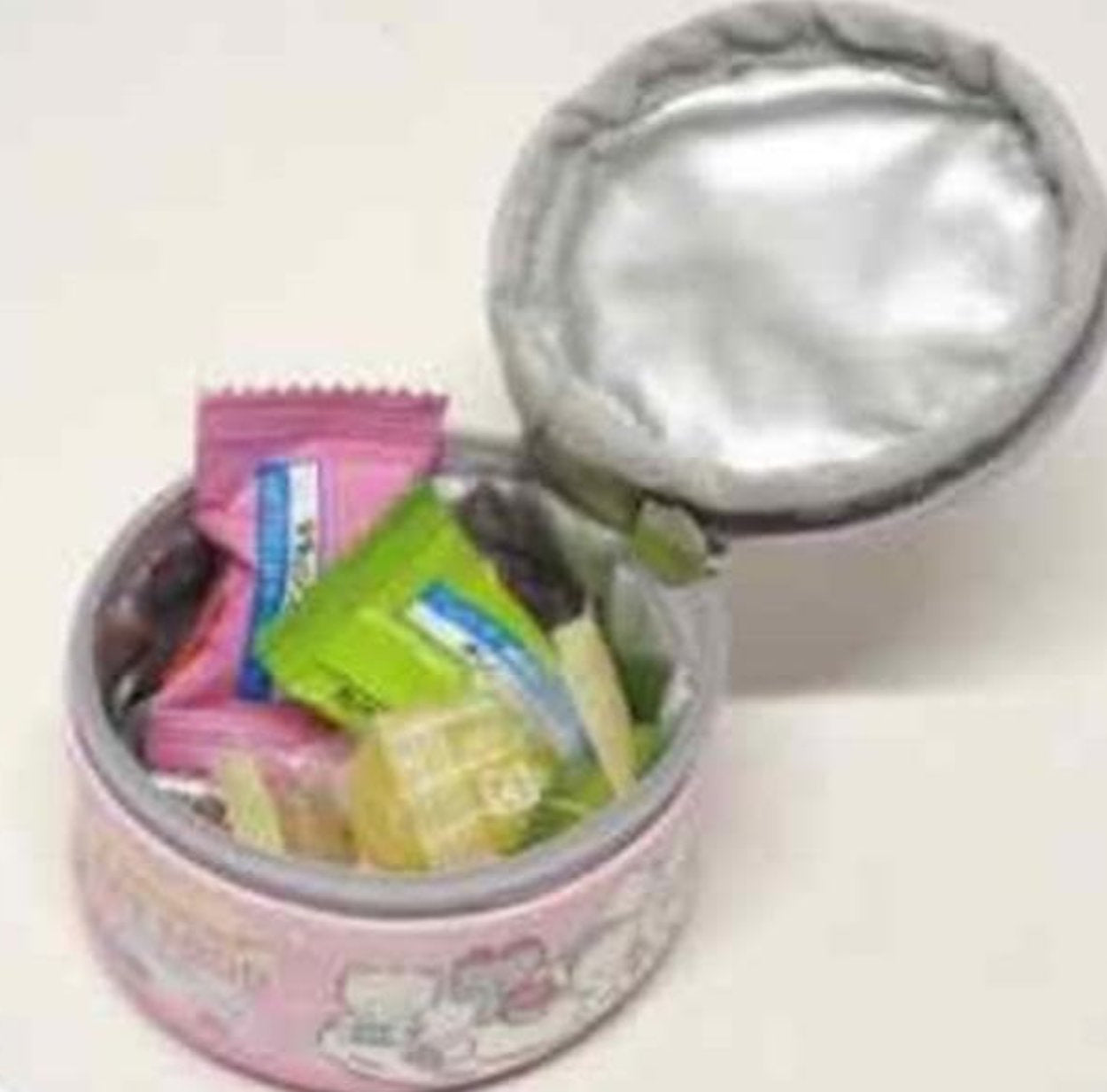 Small kawaii round pouch open showing storage space for sweets or accessories