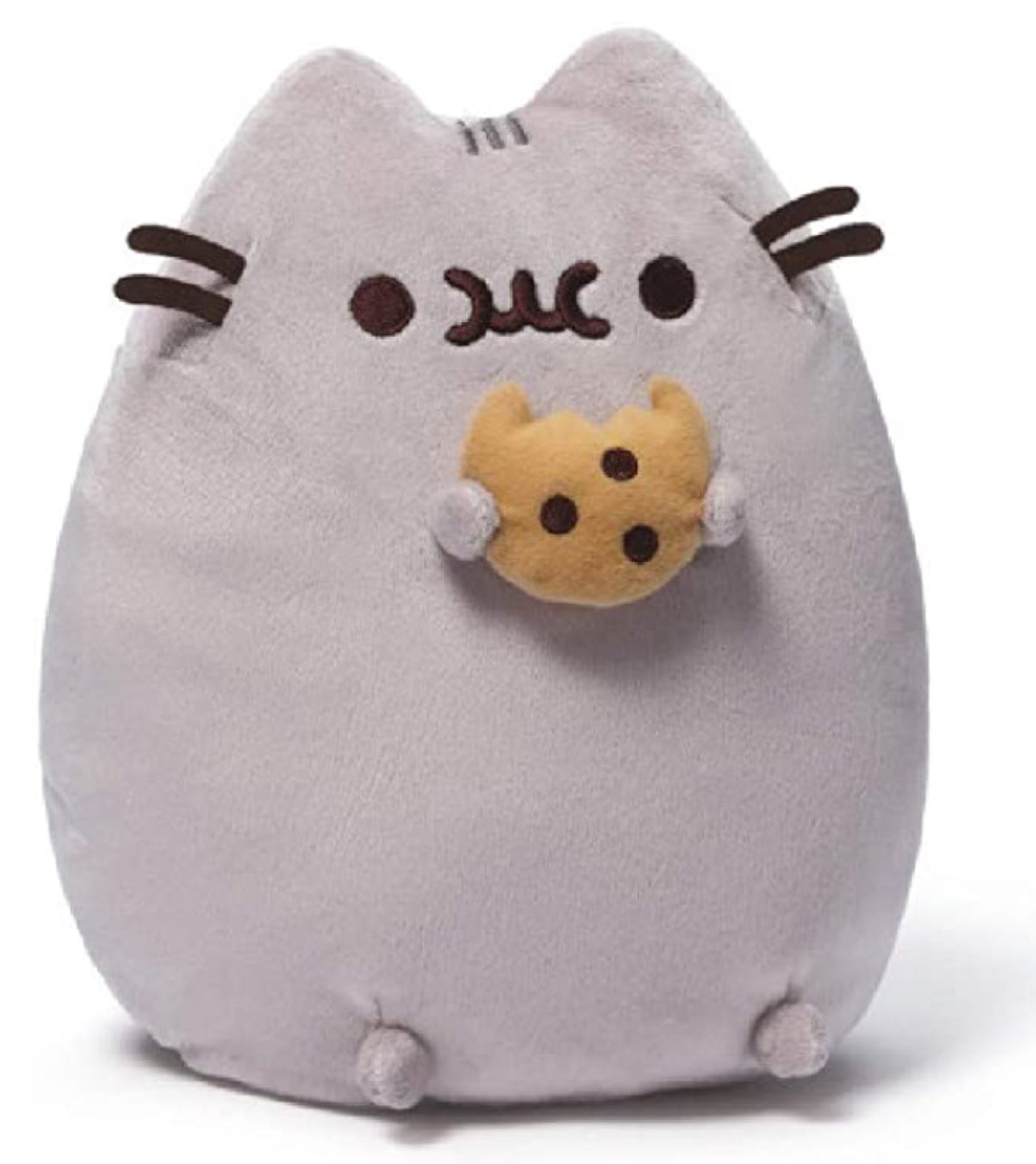 Pusheen plush toy holding a cookie sitting upright