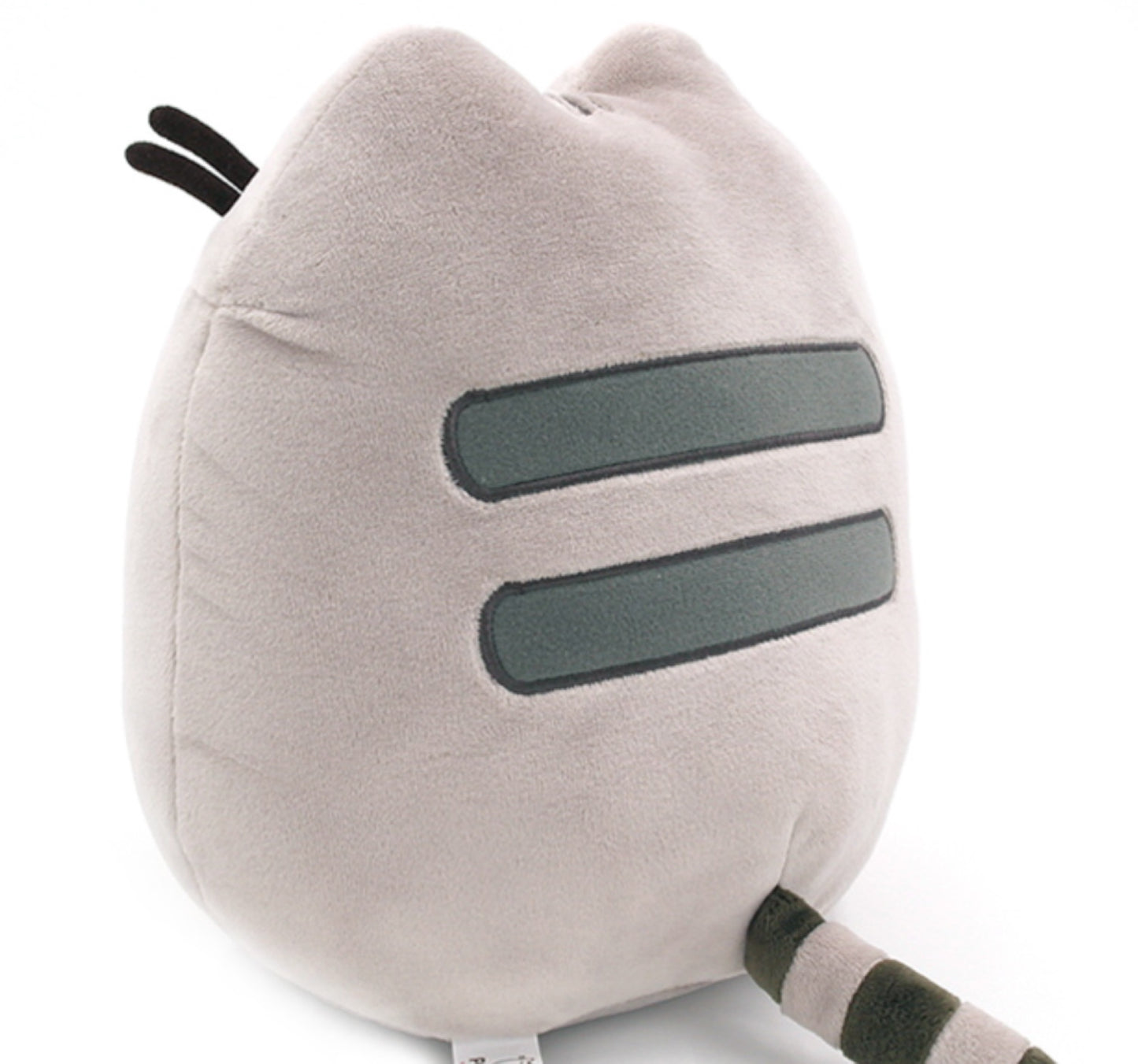Pusheen plush toy holding a cookie sitting upright back view